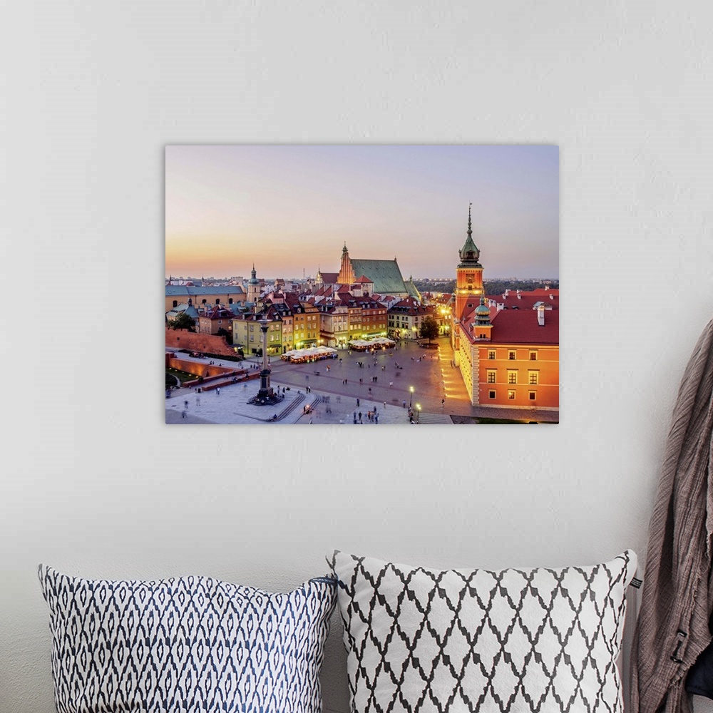 A bohemian room featuring Poland, Masovian Voivodeship, Warsaw, Old Town, Elevated view of the Castle Square at twilight.