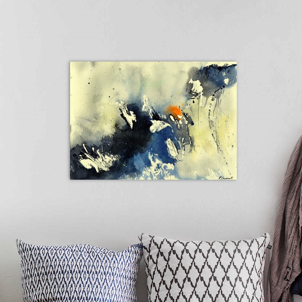A bohemian room featuring A horizontal abstract painting in shades of black, blue, orange and yellow with splatters of pain...