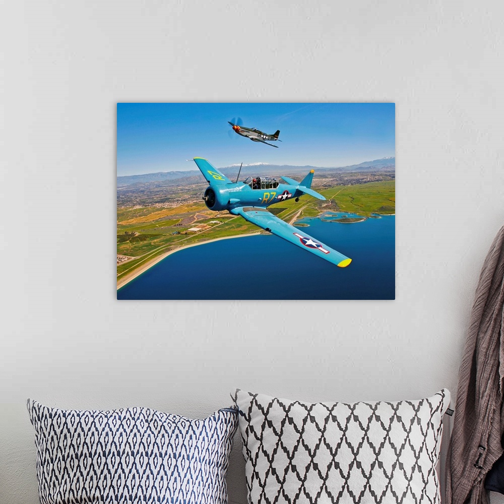 A bohemian room featuring A North American T-6 Texan and a P-51D Mustang in flight over Chino, California.