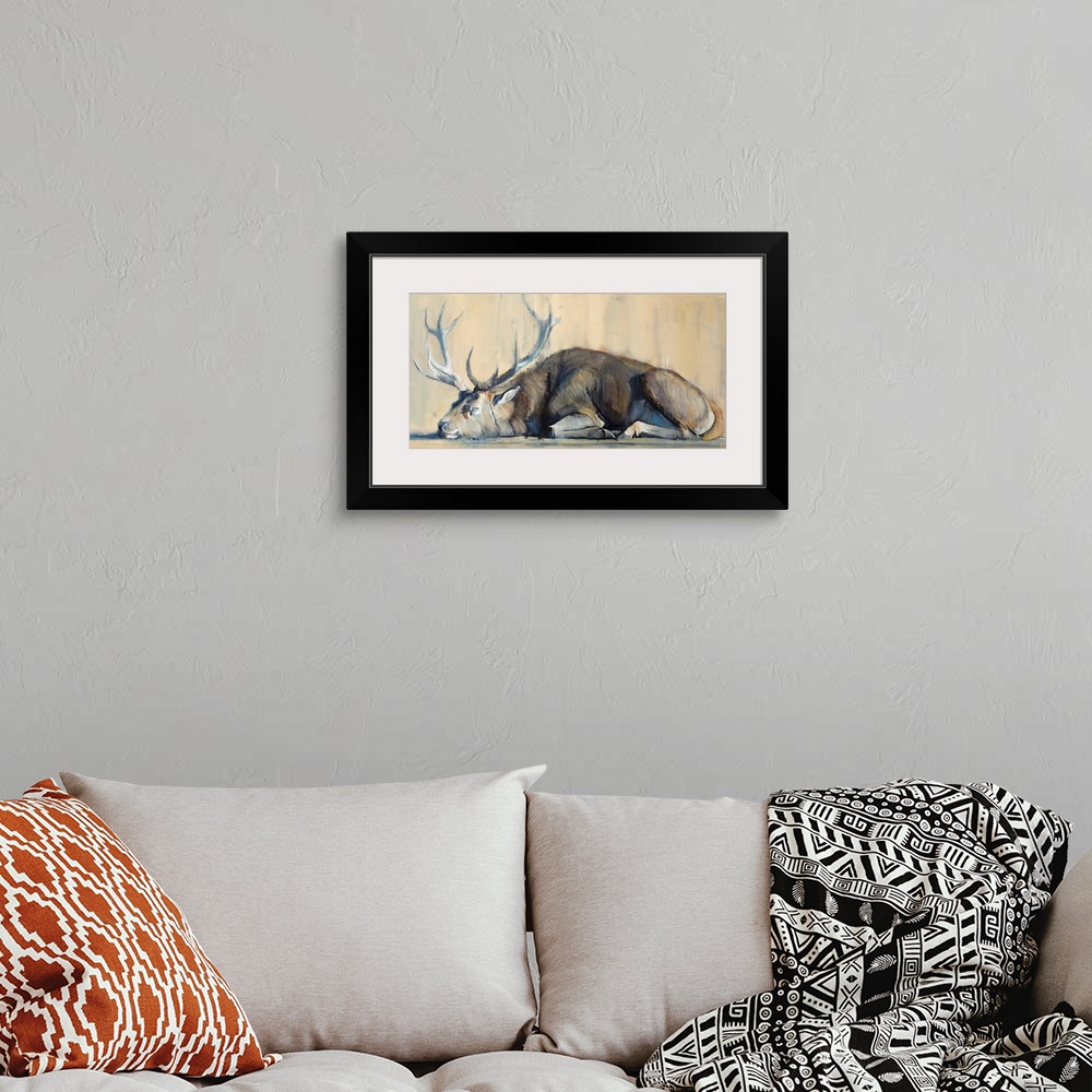 A bohemian room featuring Contemporary artwork of a stag against an earthy background.