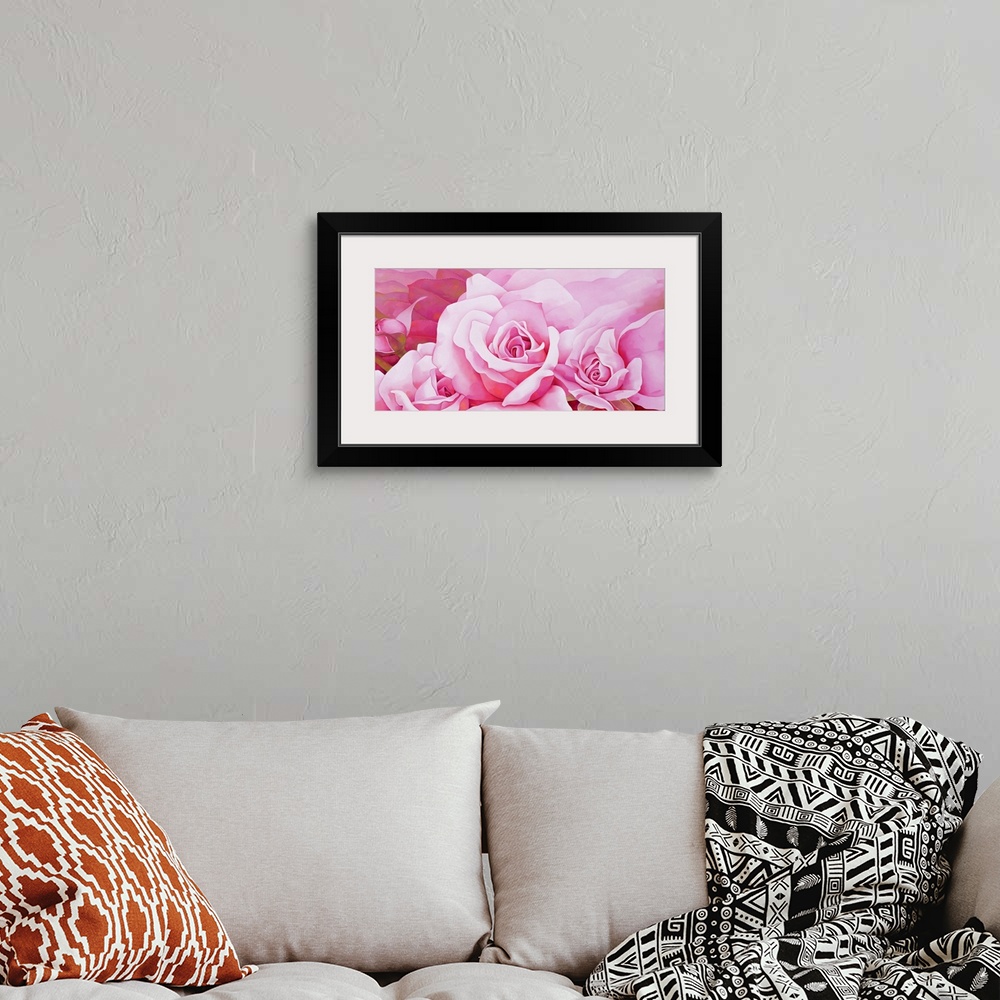 A bohemian room featuring A beautiful painting of full bloom and blooming pink roses.