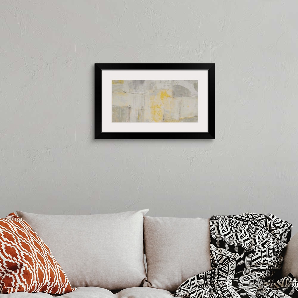A bohemian room featuring Contemporary abstract artwork in pale, muted shades of grey and yellow.