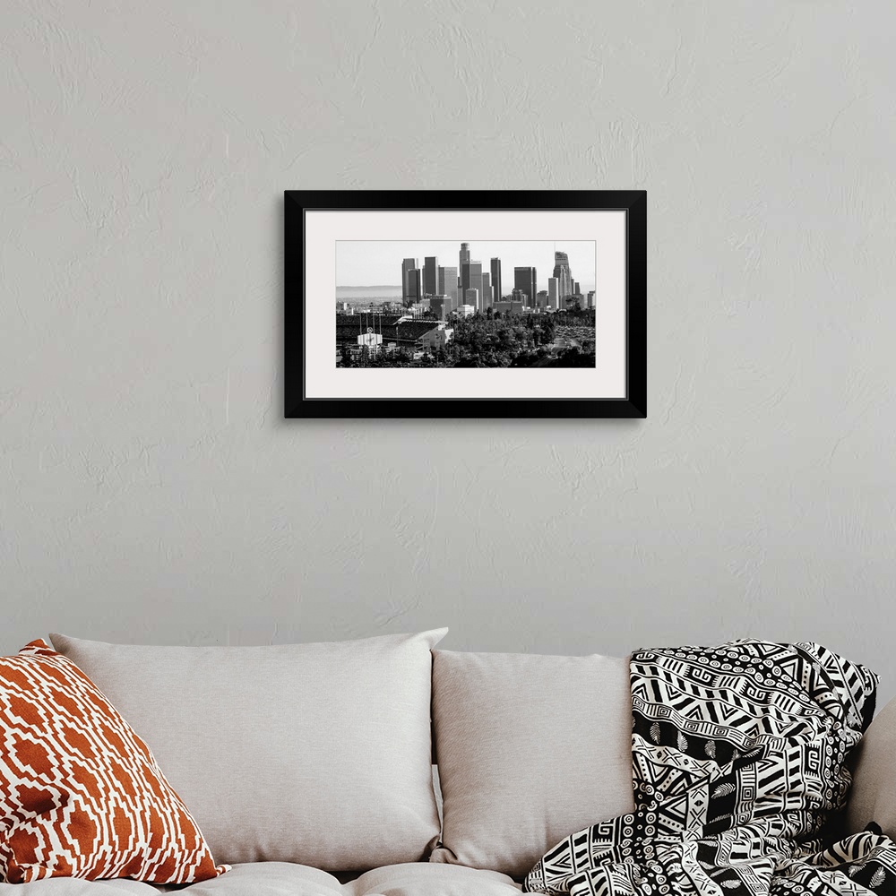 A bohemian room featuring Photograph of the downtown Los Angeles skyline with Dodger Stadium on the left.