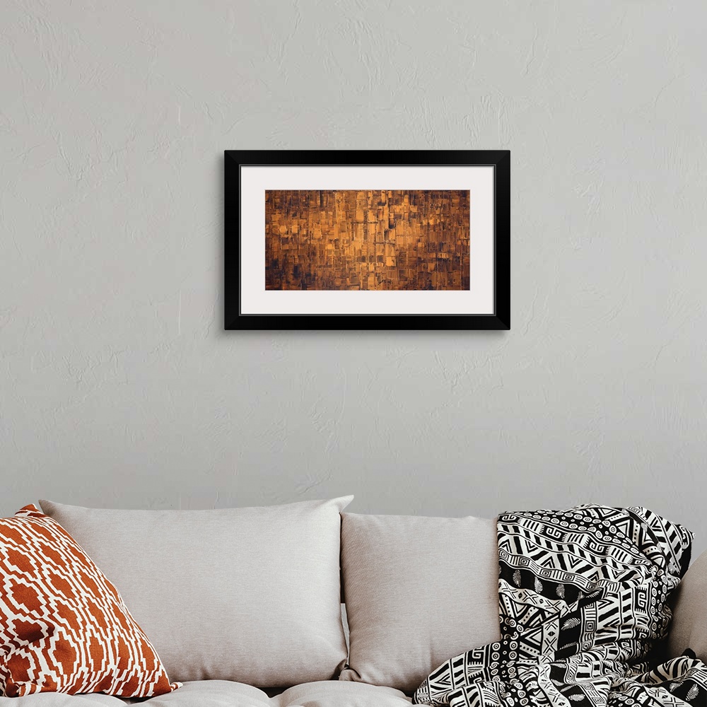 A bohemian room featuring Large brown and bronze abstract painting.