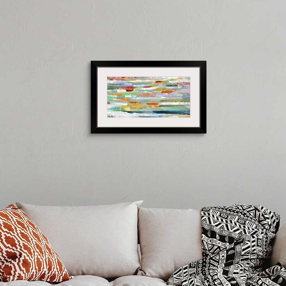 A bohemian room featuring A contemporary abstract painting of multi-colored horizontal lines.