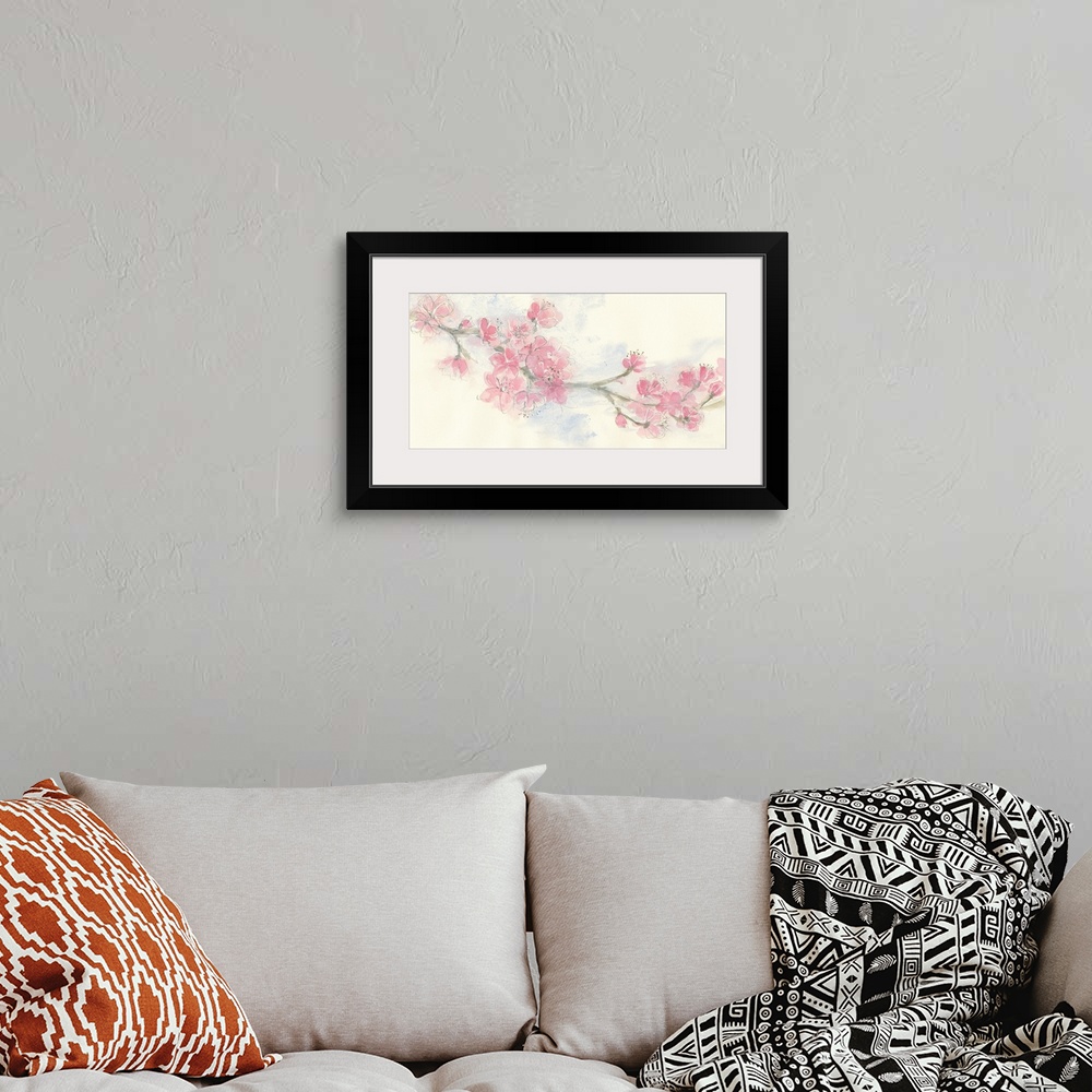 A bohemian room featuring Contemporary artwork of a branch with blooming pink flowers.