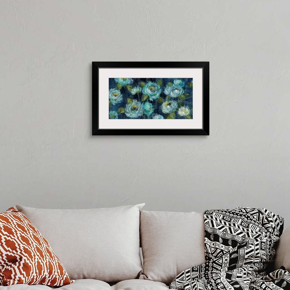 A bohemian room featuring Contemporary artwork of bright blue flowers against a navy blue background.