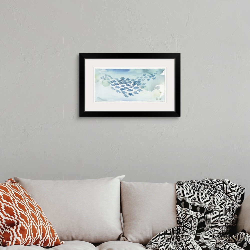 A bohemian room featuring Watercolor painting of a school of fish against a light blue background.