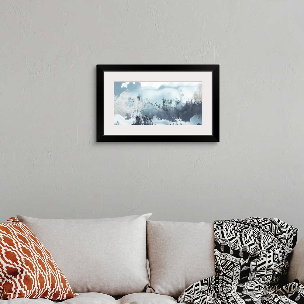 A bohemian room featuring Horizontal abstract painting of blended blue tones of watercolor.