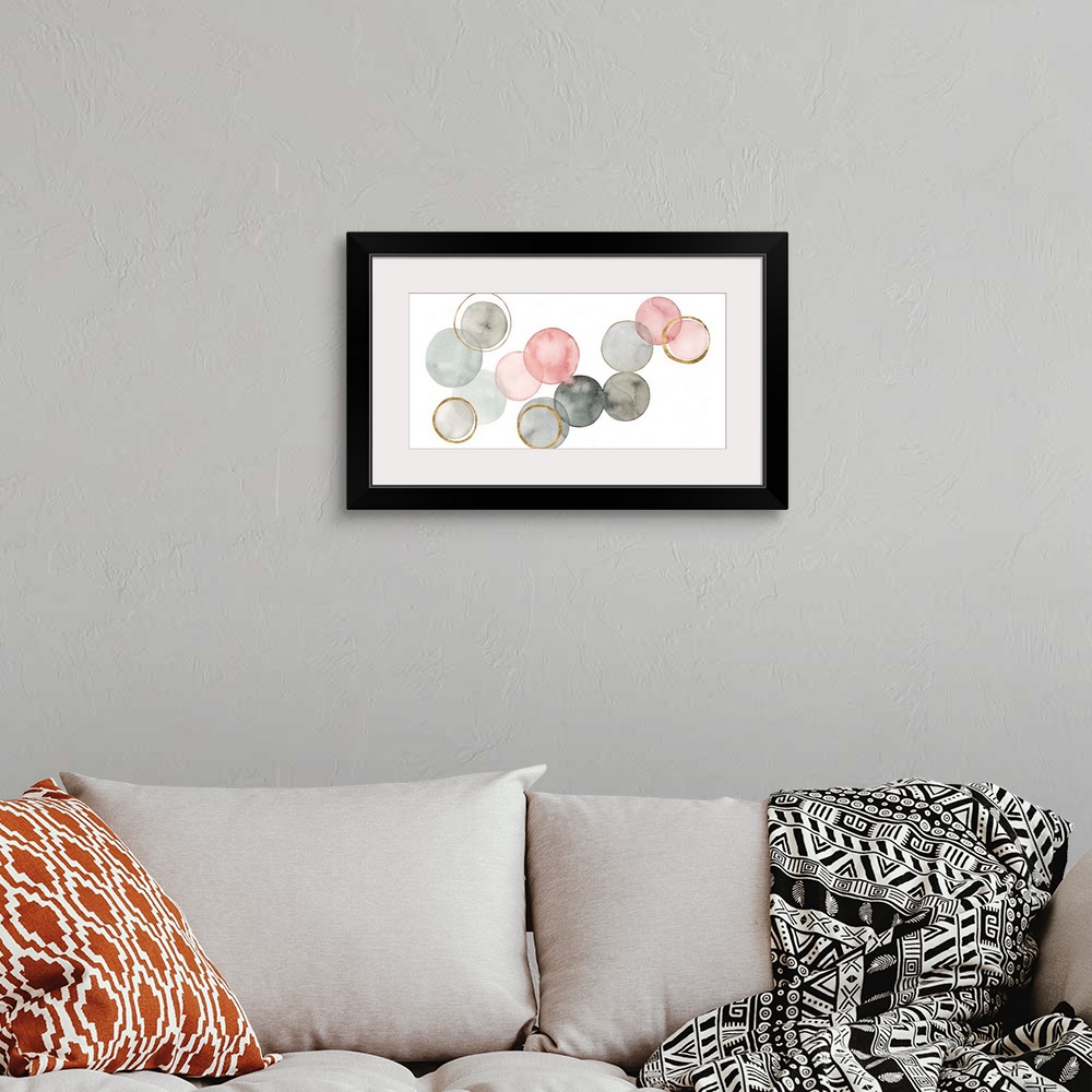 A bohemian room featuring Contemporary abstract painting with watercolored circles connecting together in shades of gray an...