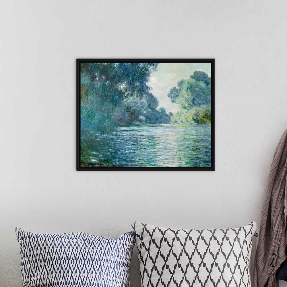 A bohemian room featuring Oil painting of river with large trees and bushes on both sides that are reflected in the stream ...