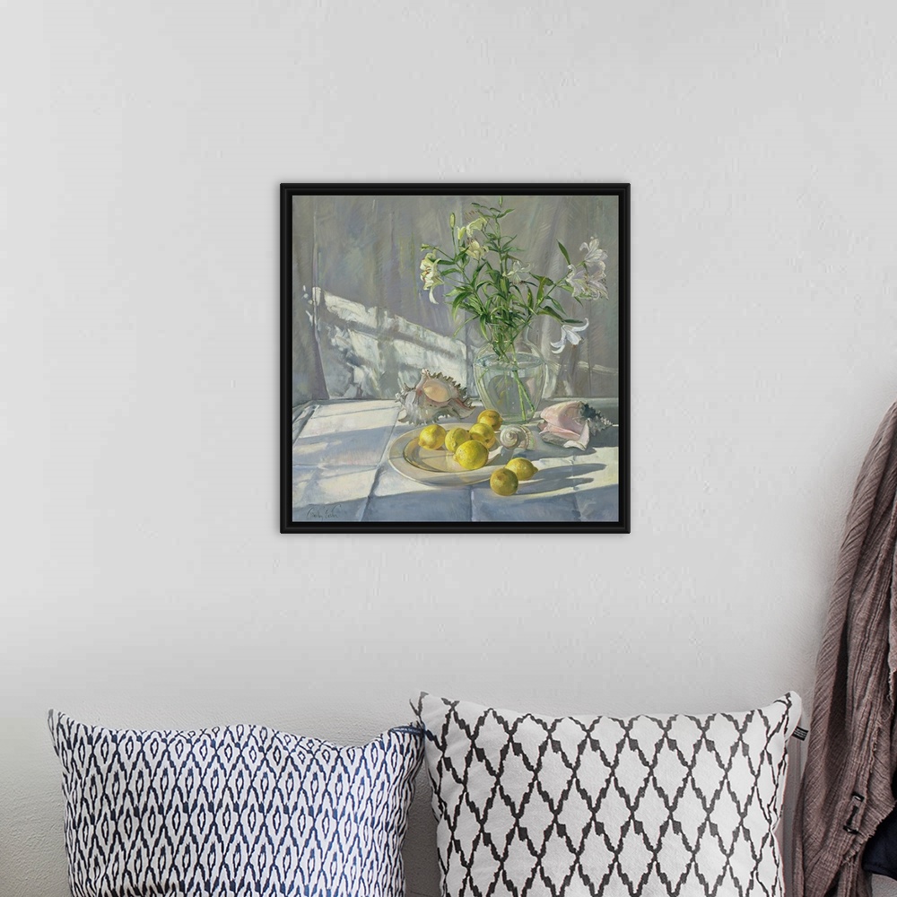 A bohemian room featuring Square oil painting of flowers in a vase with sea shells scattered around and lemons on a plate.