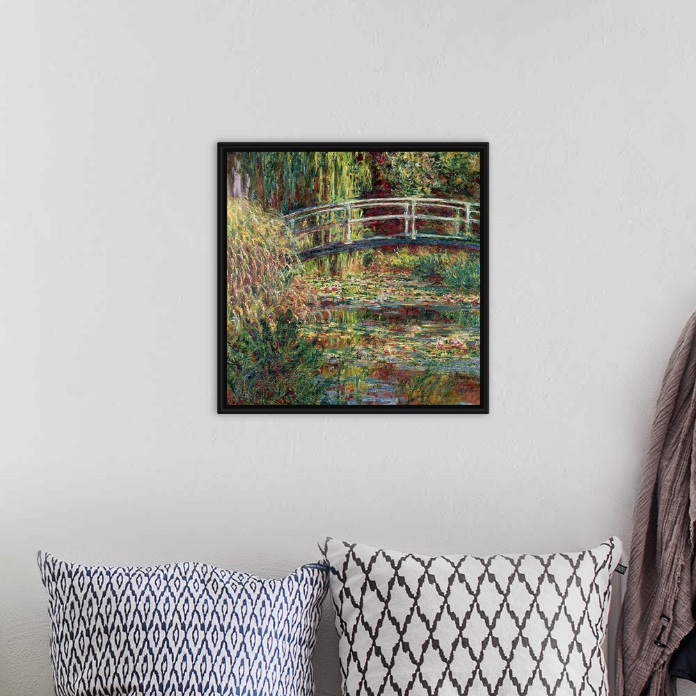 A bohemian room featuring Landscape painting of a bridge over a garden pond filled with water and marsh plants.