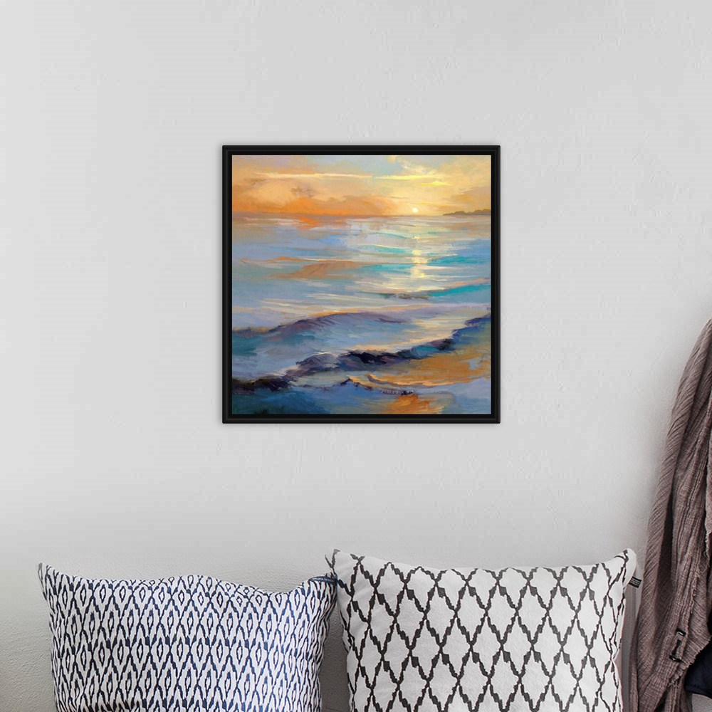 A bohemian room featuring Square painting of gentle waves in the ocean with the sun reflecting in the water.