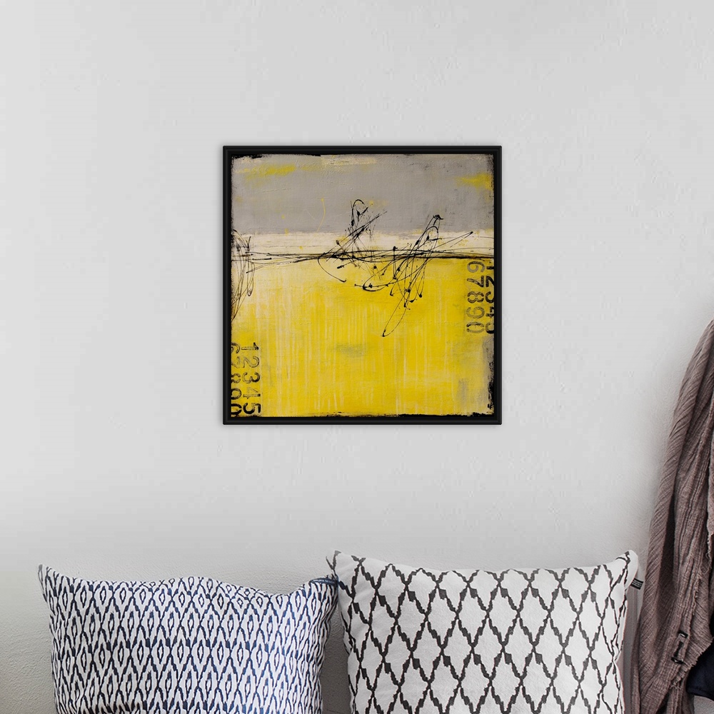 A bohemian room featuring A contemporary abstract painting using gray and yellow with stenciled numbers and thin dark black...