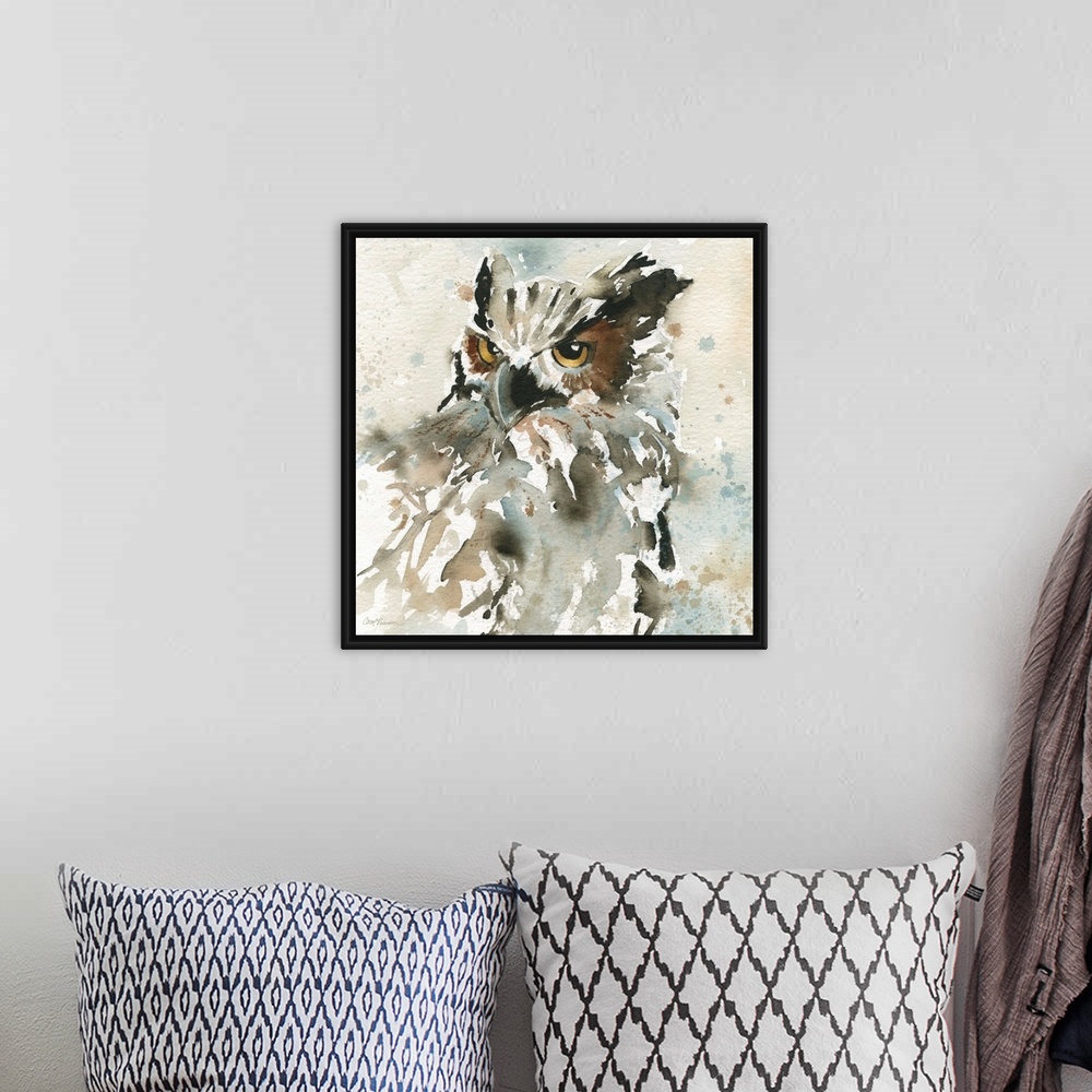 A bohemian room featuring A watercolor painting of an abstract owl with a neutral background that has paint splattered on it.