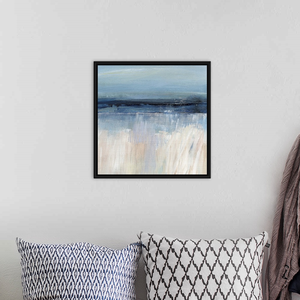 A bohemian room featuring Square abstract painting of a seascape with the sandy beach at the bottom and the ocean and sky a...