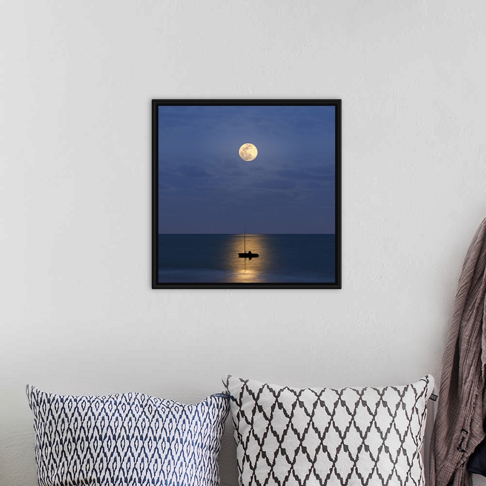 A bohemian room featuring Silhouette sailboat with moon