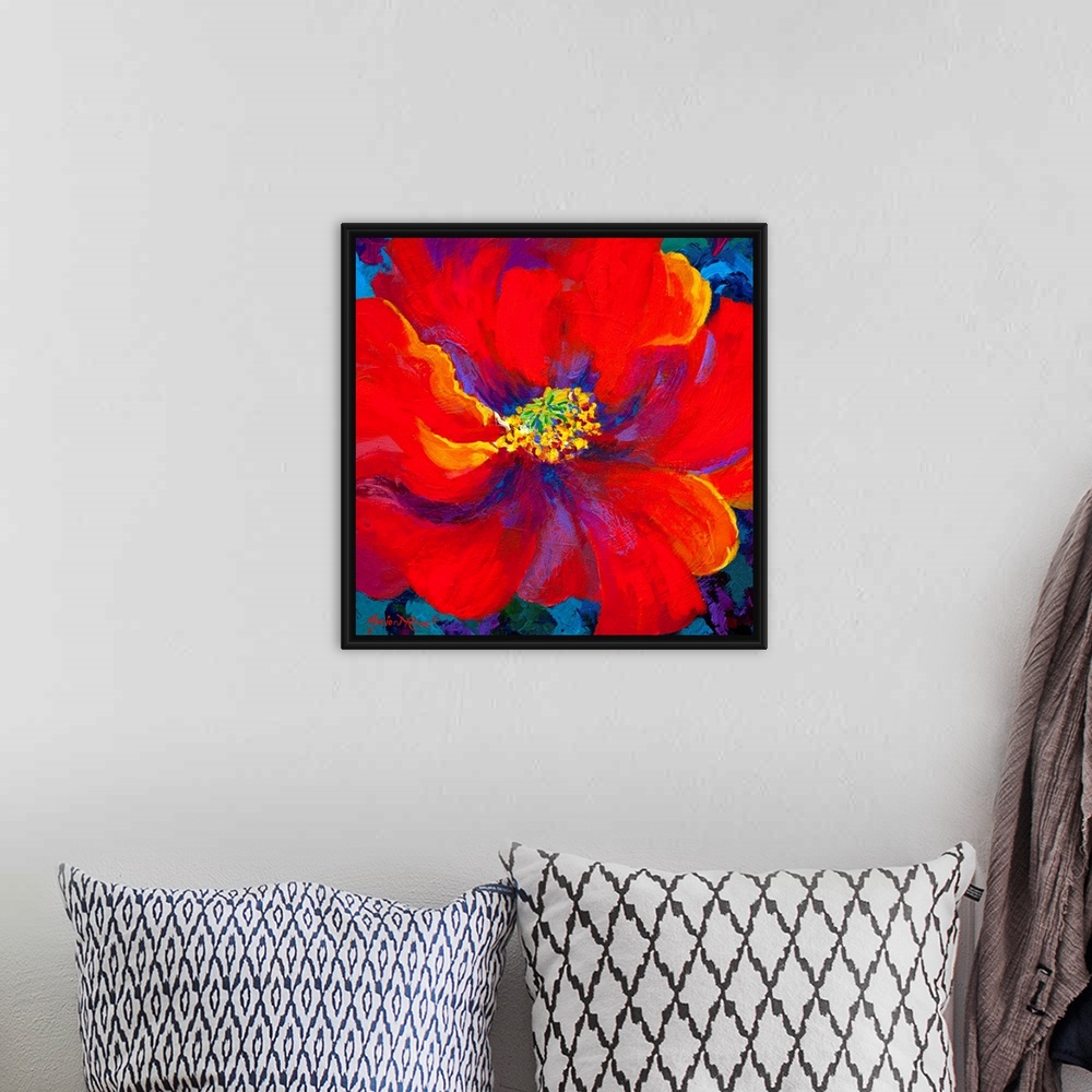 A bohemian room featuring A contemporary artwork piece of a large red flower with accents of colors painted within it and a...
