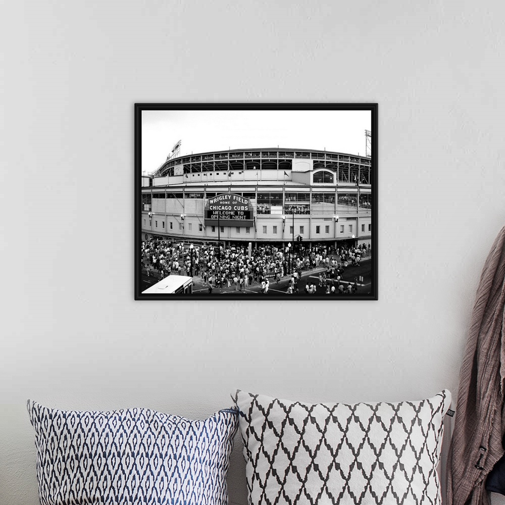 A bohemian room featuring A black and white photograph taken outside of the Chicago Cubs stadium as fans are shown entering...