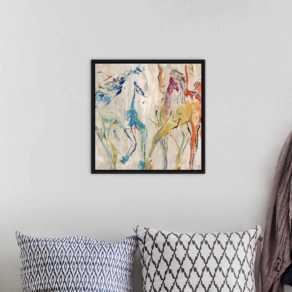 A bohemian room featuring Contemporary painting of two horse figures in bright blue and red.