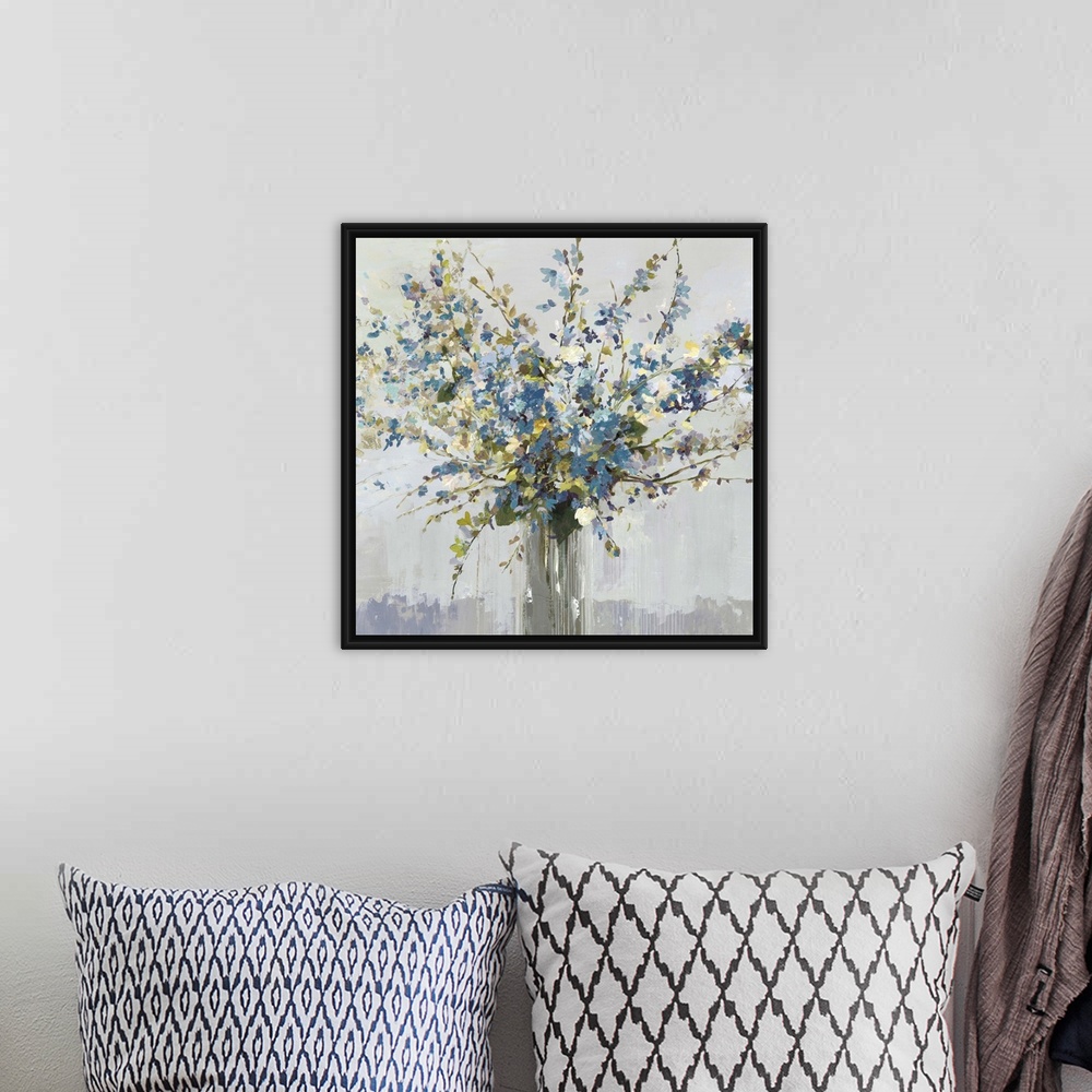 A bohemian room featuring Contemporary artwork of a vase full of blue and white flowers.