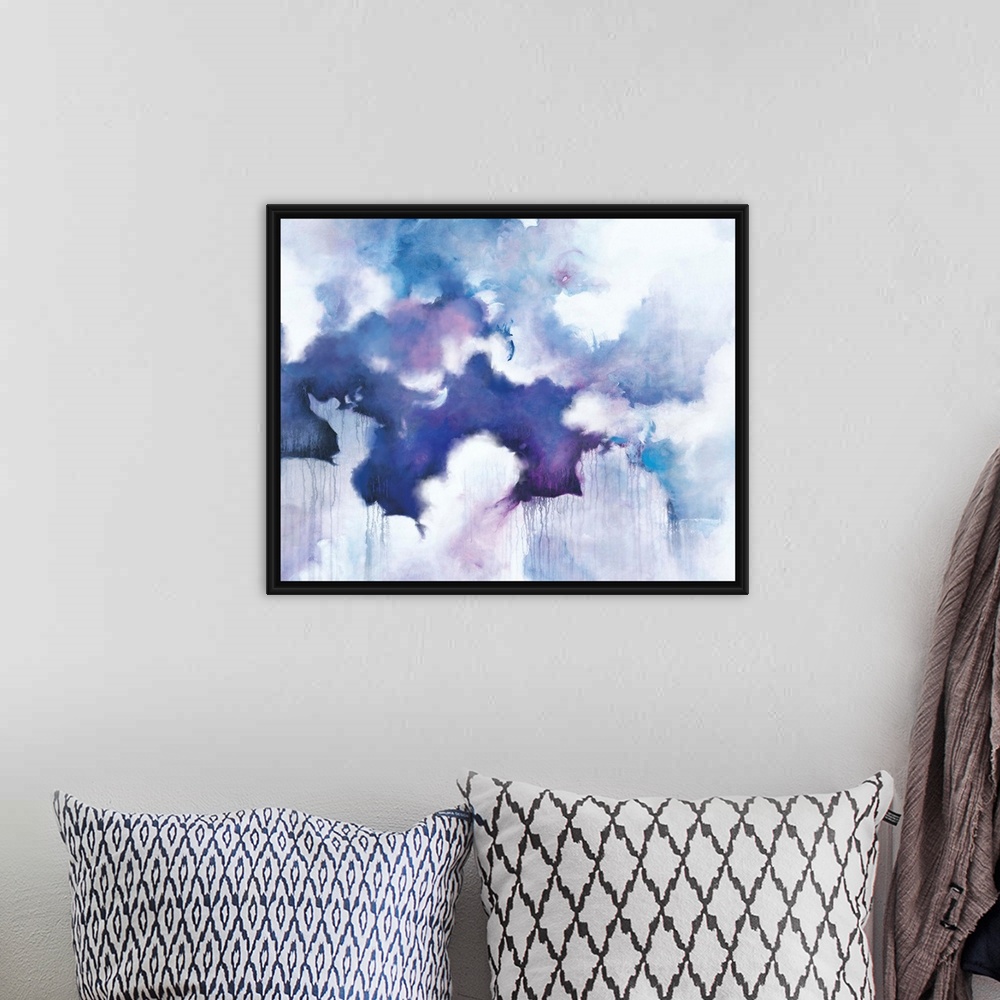 A bohemian room featuring Abstract contemporary painting in blue and purple tones, resembling a cloudy sky.