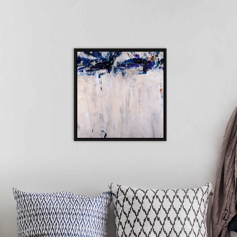 A bohemian room featuring This artwork is a square gicloe print of an abstract painting with dark shapes decorating the top...