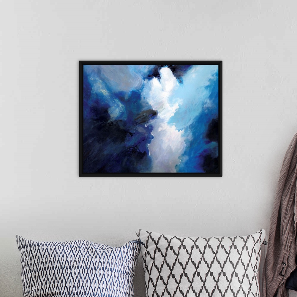 A bohemian room featuring Contemporary abstract artwork resembling dark clouds before a storm.