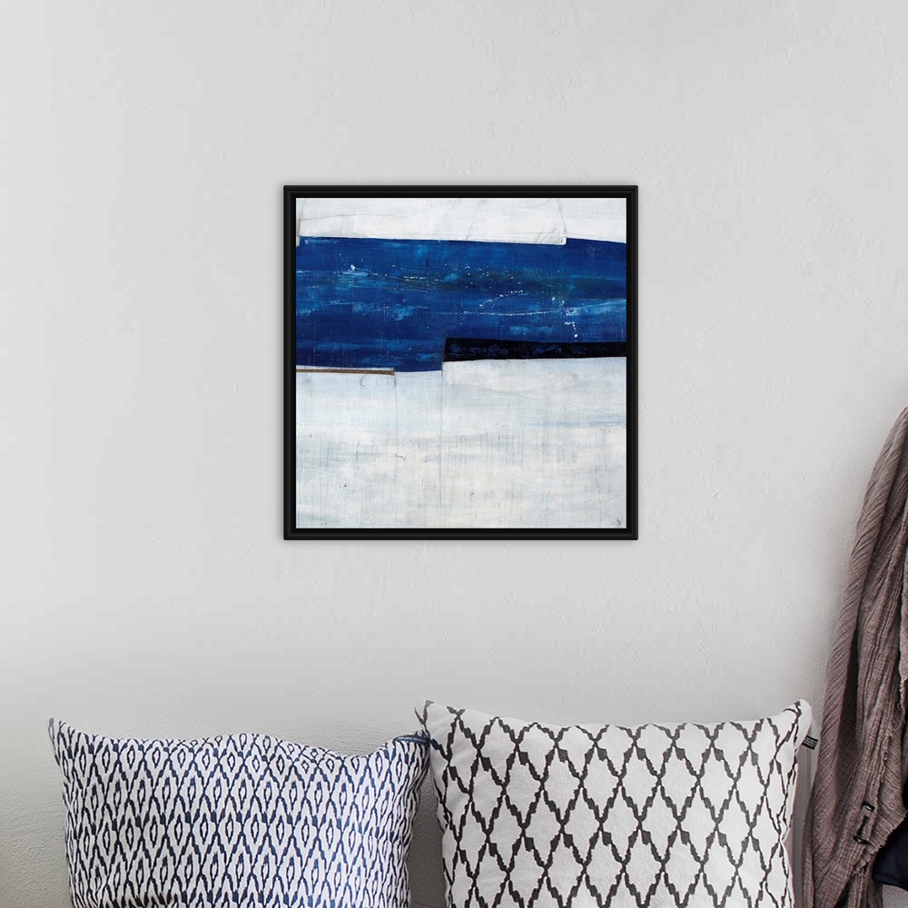 A bohemian room featuring Abstract painting of a navy blue strip over a cool, gray-blue background.