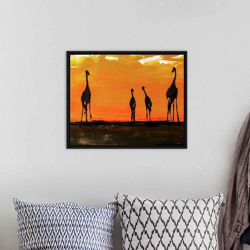 A bohemian room featuring Portrait of giraffes on the African plain in front of a vibrant, orange background.