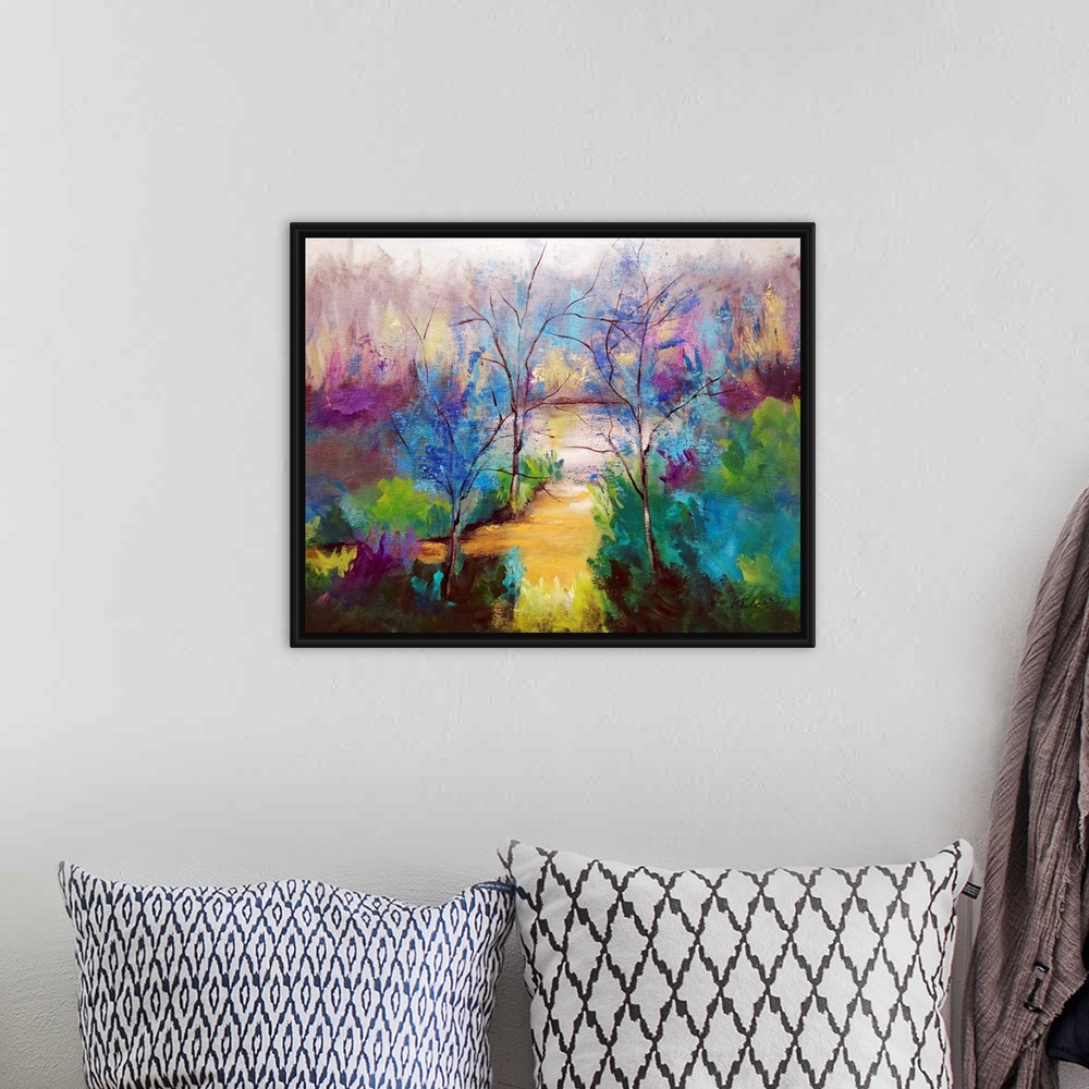 A bohemian room featuring Large painting of a clearing in a forest.
