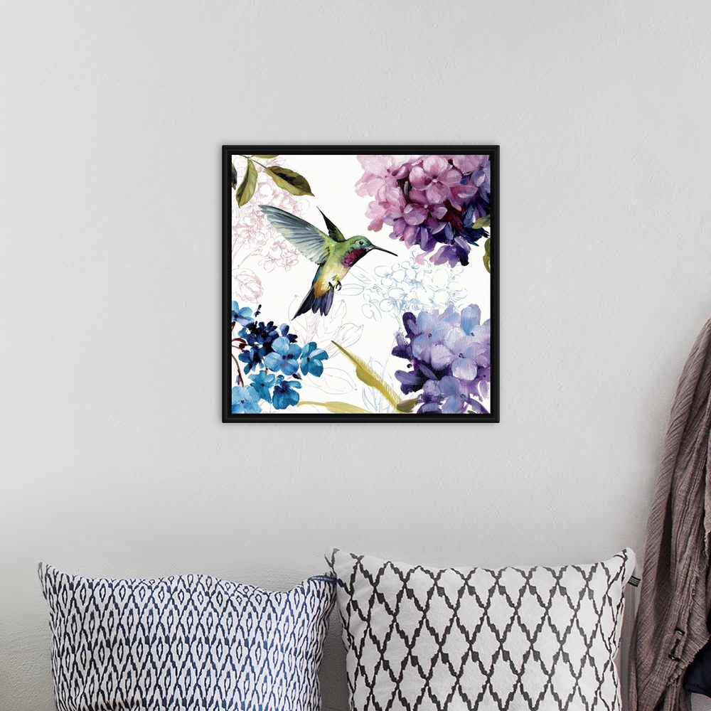 A bohemian room featuring Home docor painting of a hummingbird in flight surrounded by hydrangea flower blooms.
