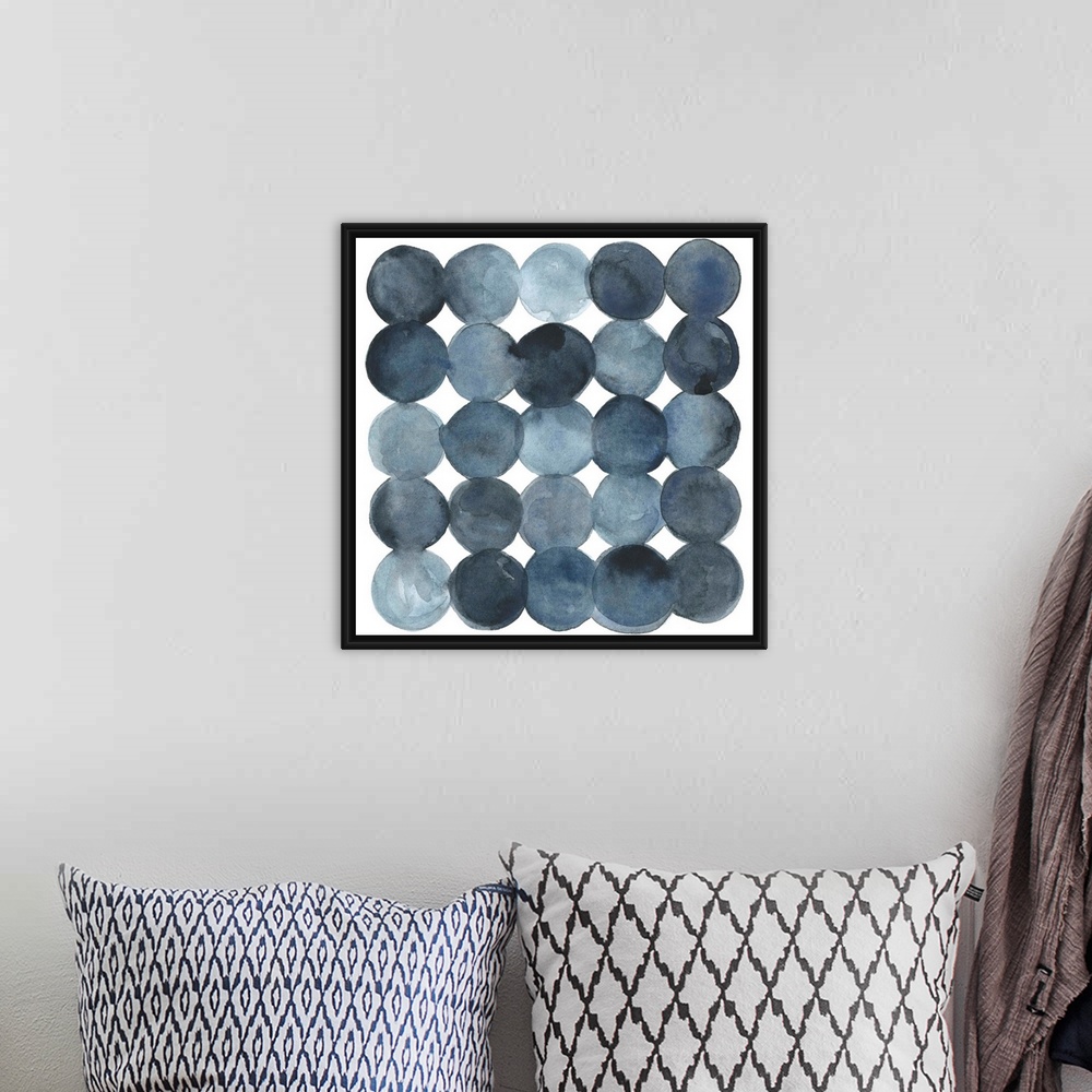 A bohemian room featuring Dot-patterned abstract watercolor painting of blue-gray tones.