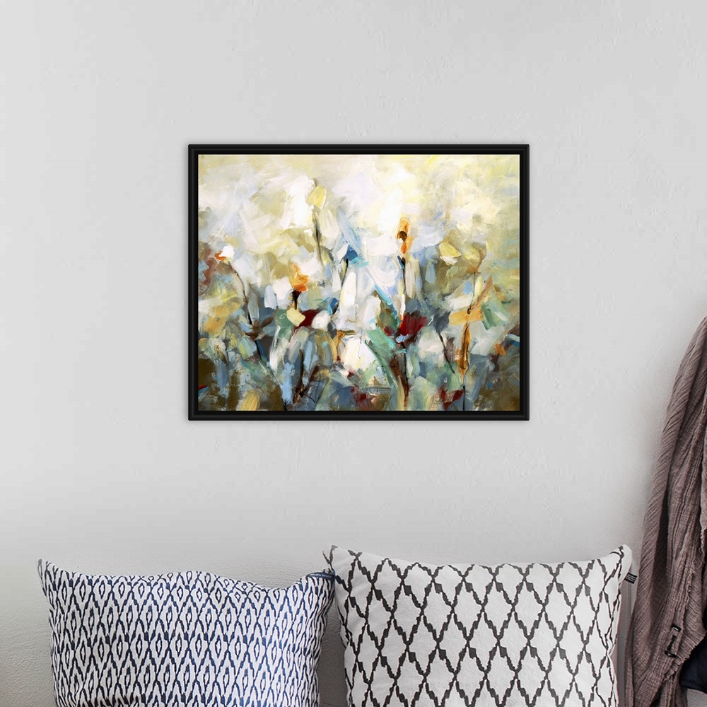A bohemian room featuring Impressionist style artwork of flowers in bloom.