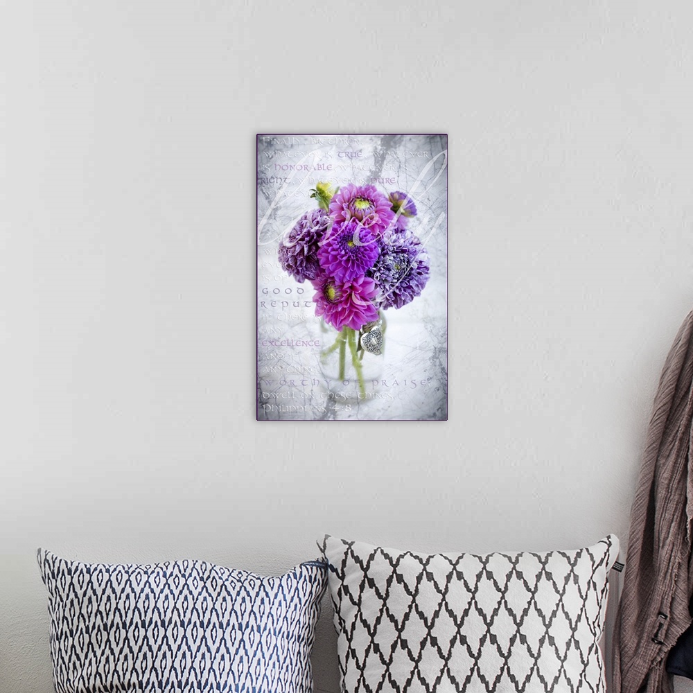 A bohemian room featuring Marbled purple dahlia's arranged in a glass jar with Philippians 4:8 written in the background, a...