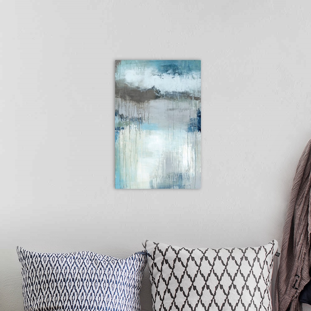 A bohemian room featuring Vertical abstract painting in textured colors of blue, brown, white and gray.