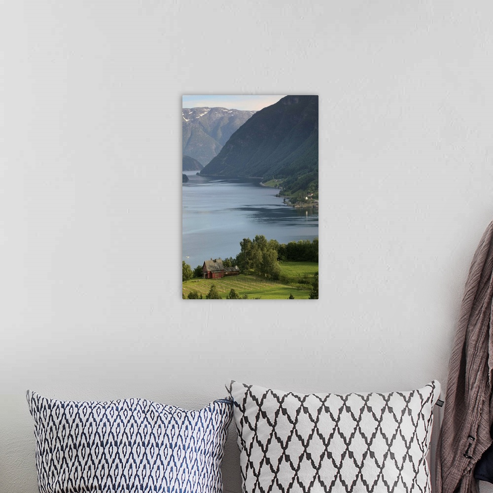 A bohemian room featuring evening light settles upon Ulvik and the shores of Hardanger Fjord, Norway