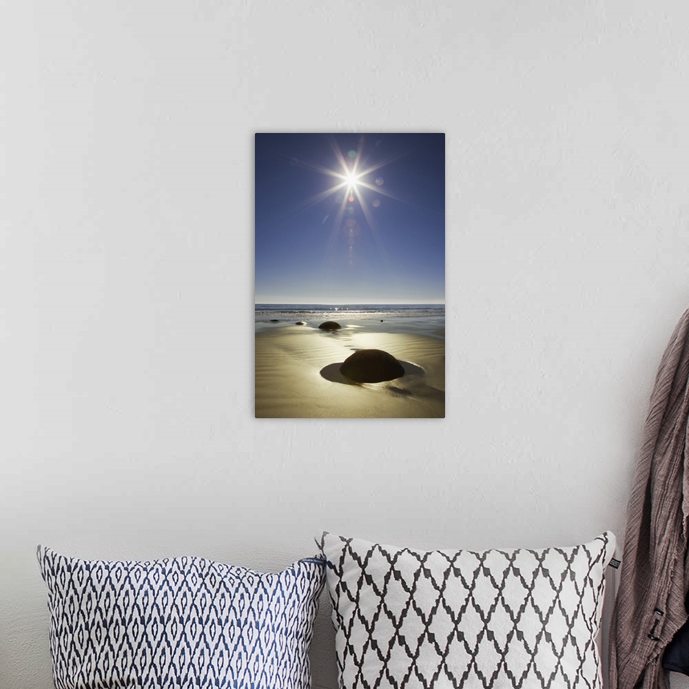A bohemian room featuring New Zealand, South Island. Starburst over Moeraki Boulders Scenic Reserve.