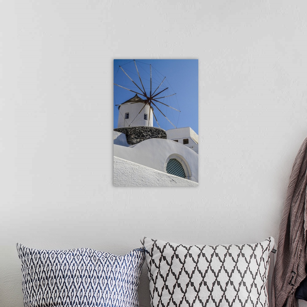 A bohemian room featuring Santorini, Greece. White Washed Buildings and the Aegean Blue Sky.