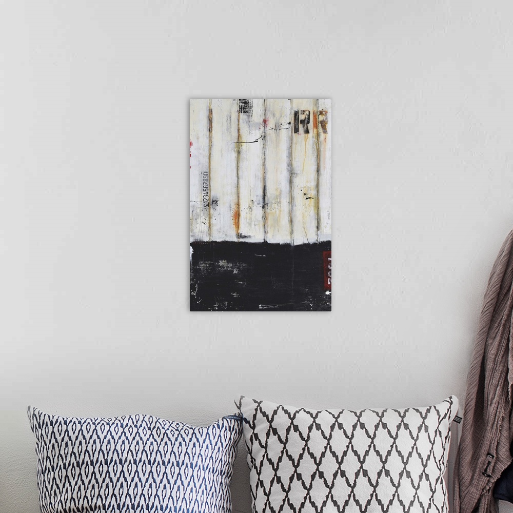 A bohemian room featuring Contemporary abstract painting using black and putty with stenciled letters.
