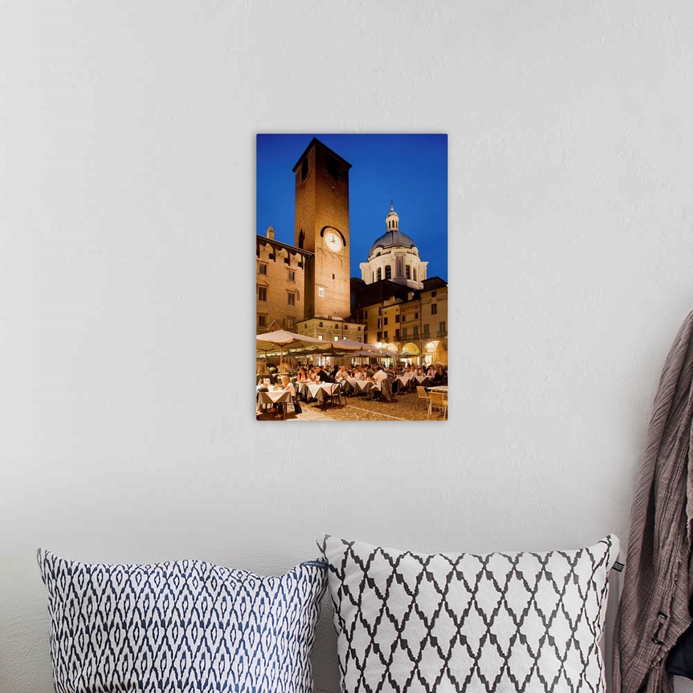 A bohemian room featuring Italy, Italia, Lombardy, Lombardia, Mantua, Mantova, Piazza Broletto, the clock tower of the Pala...