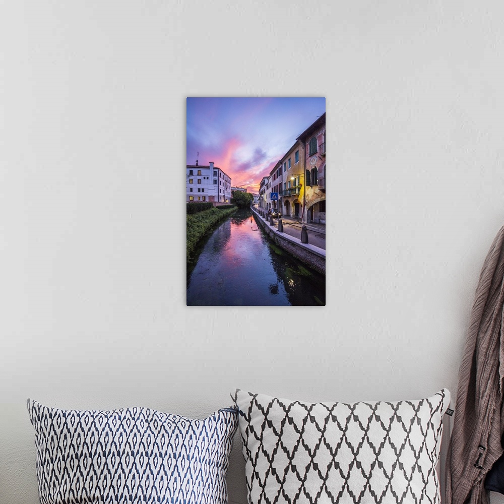 A bohemian room featuring Italy, Veneto, Mediterranean area, Treviso district, Treviso, Buranelli canal at sunset