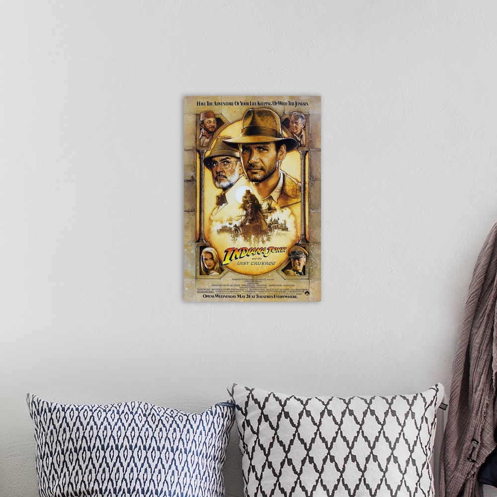 A bohemian room featuring Movie poster advertising the 1989 classic family favorite movie, Indiana Jones and the Last Crusa...
