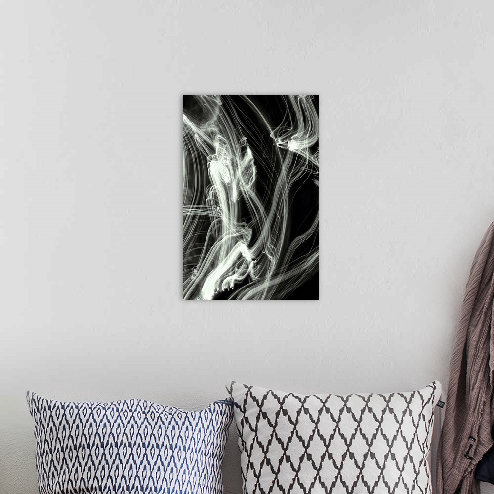 A bohemian room featuring Long exposure abstract photograph of white light trails giving a smokey look with a black backgro...