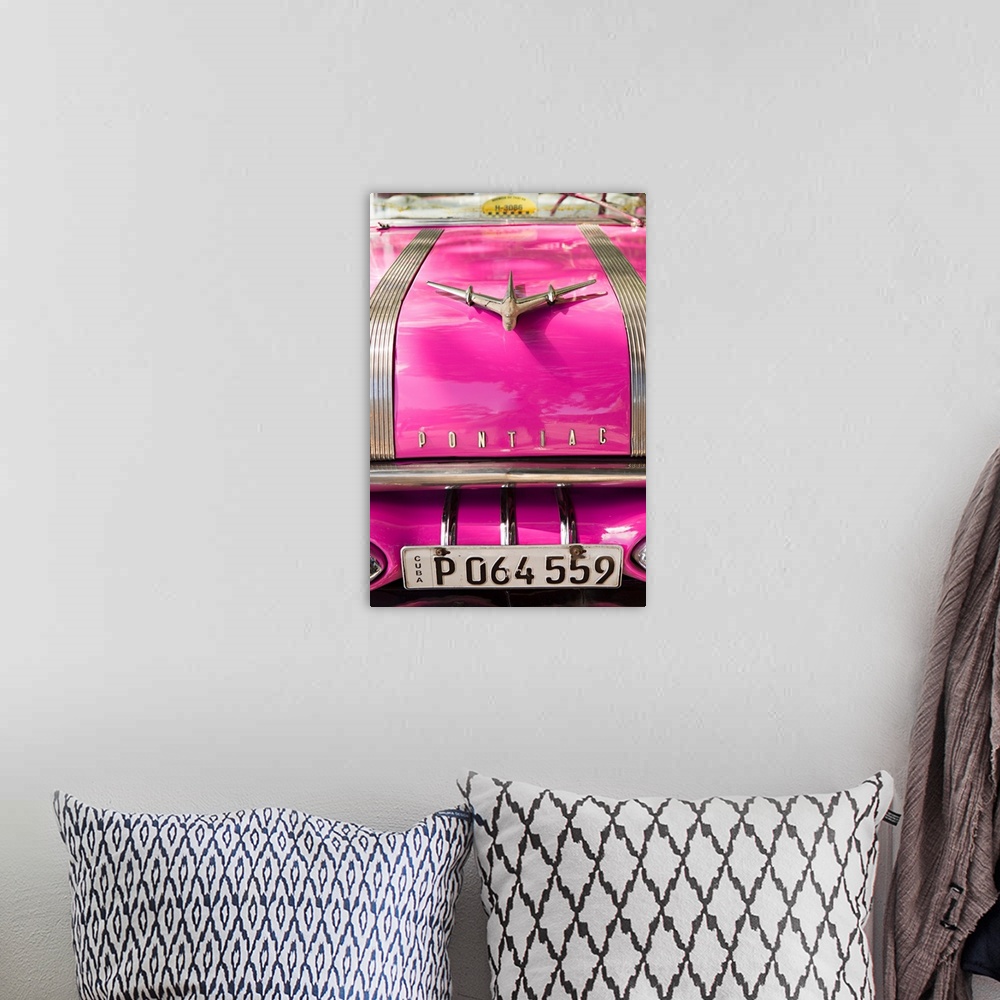 A bohemian room featuring Photograph of the front of a hot pink vintage Pontiac car in Cuba.