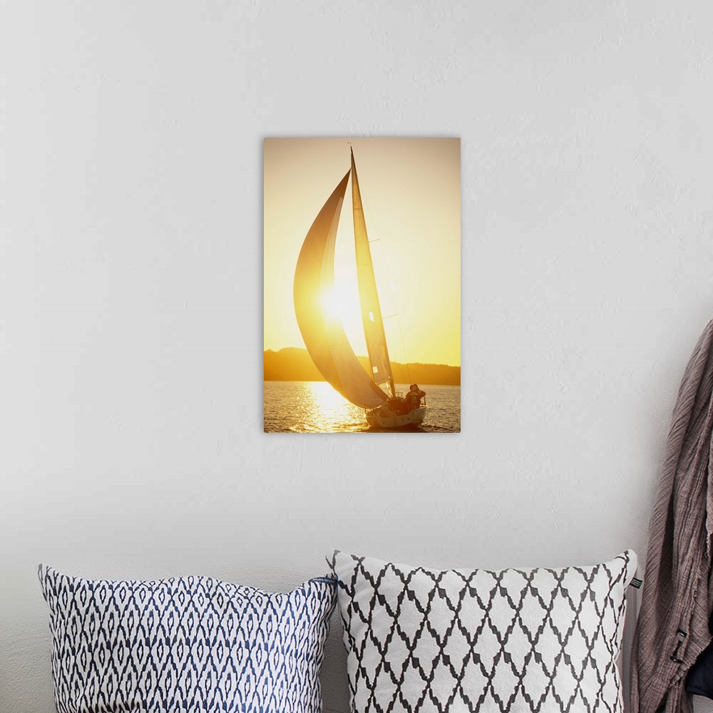 A bohemian room featuring A sailing-boat at sunset Baltic sea.