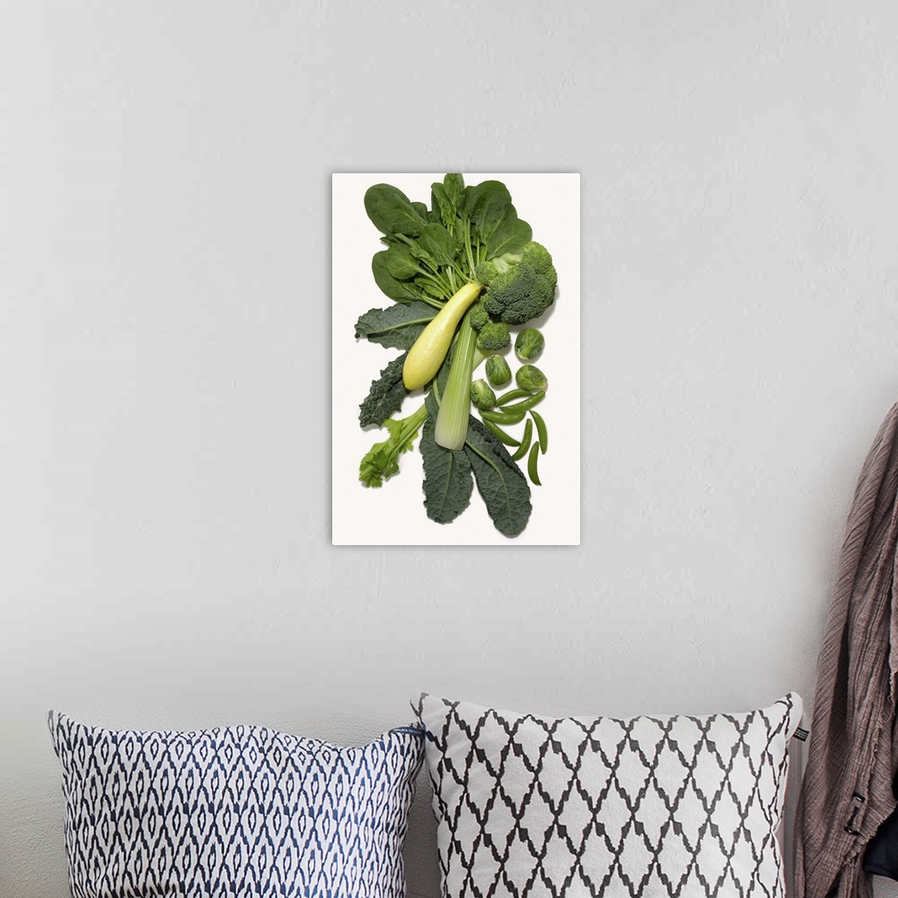 A bohemian room featuring Different green vegetables on white background