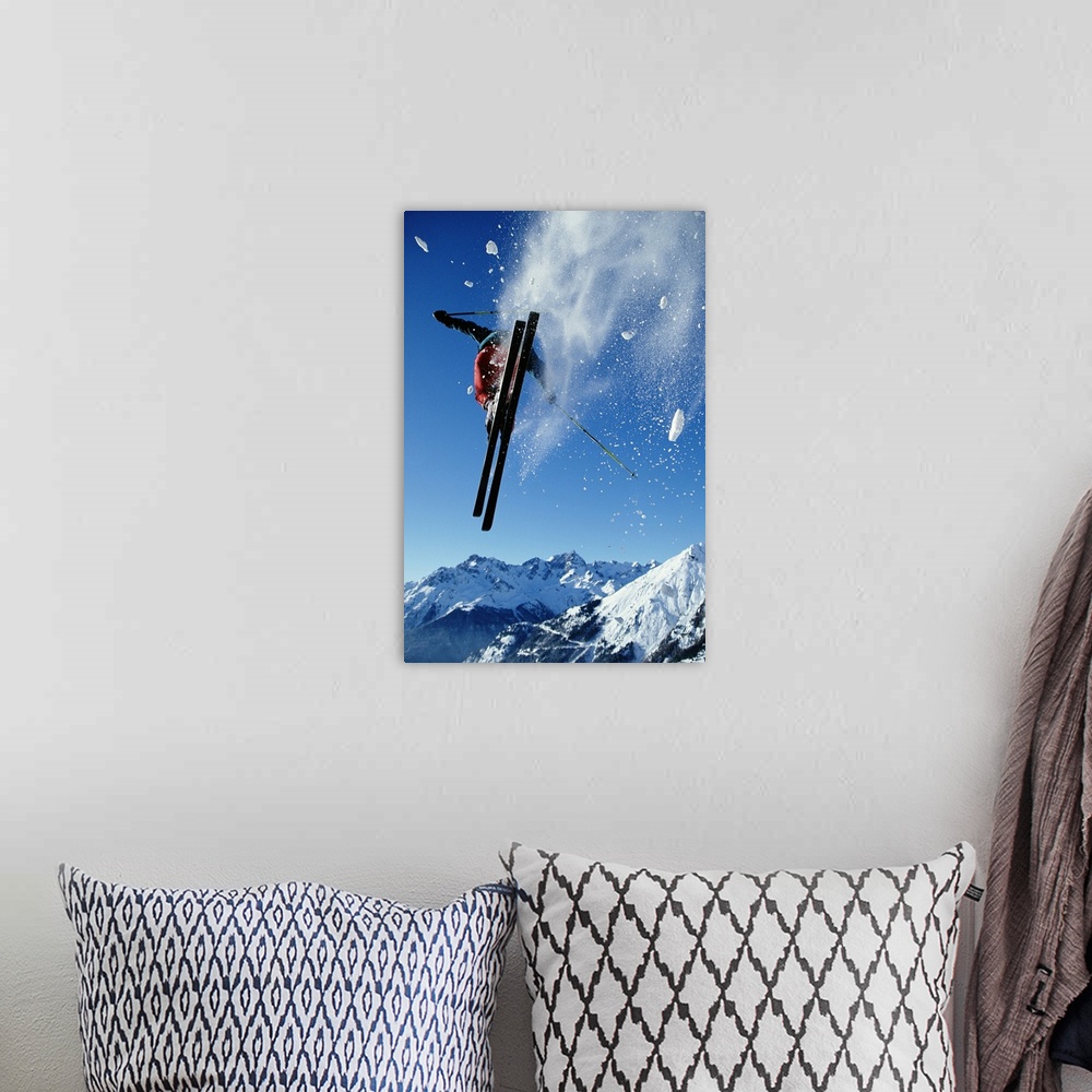 A bohemian room featuring Downhill skier in mid-air, rear view