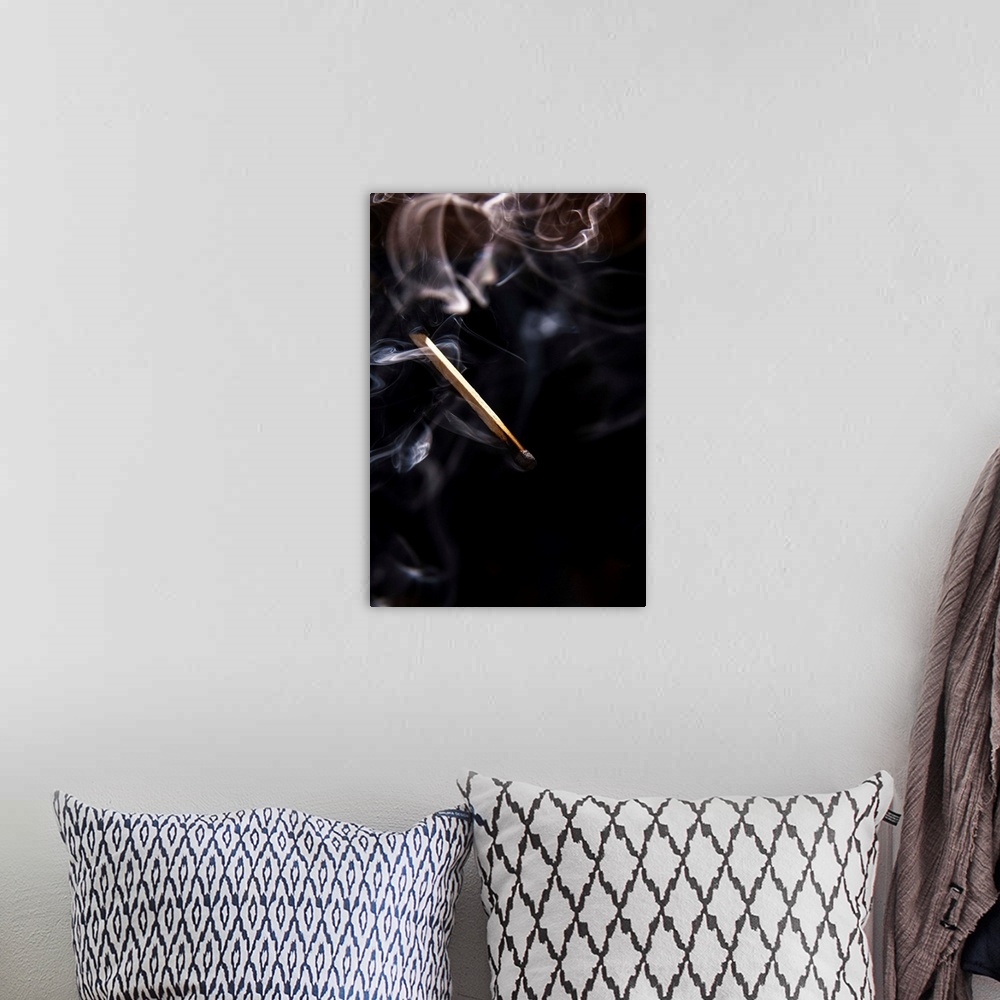 A bohemian room featuring Extinguished Smoking Match on Black Background